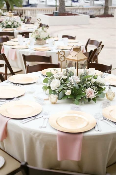 Simple centerpieces are perfect for round tables. #WeddingInspo ...