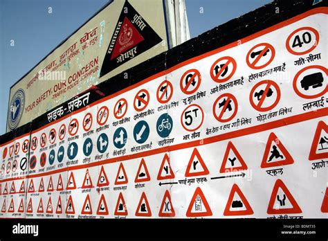 A table with hand-drawn Indian traffic signs on a street in the city of ...