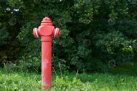 Fire hydrant in green grass 21016317 Stock Photo at Vecteezy