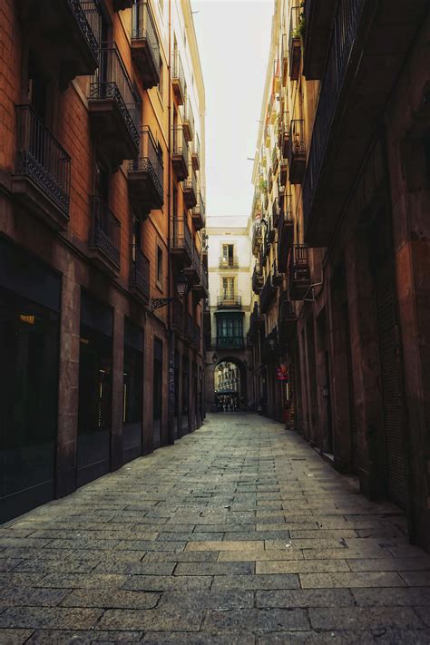 Urban Alley Photography Of Walkway Between Building During Daytime Town ...