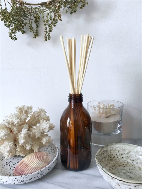 How to create a citrus summer scent diffuser with essential oils and reeds.