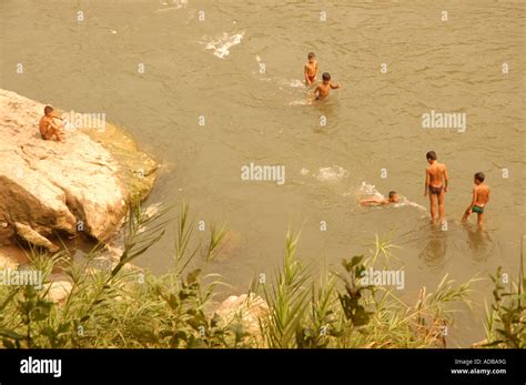 Kids swimming in river laos hi-res stock photography and images - Alamy