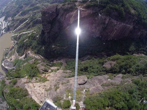 China Opens 600-Feet-High Glass-Bottomed Bridge in Canyon That Inspired ...