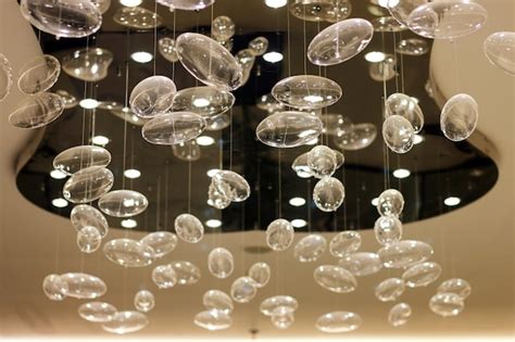 Premium Photo | A chandelier with clear glass balls hanging from it.