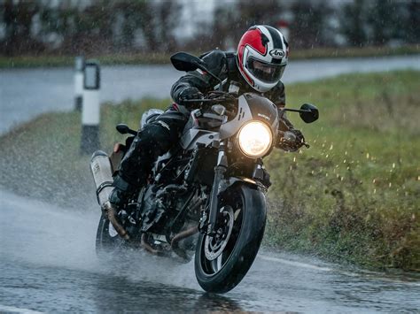 Couple On Motorcycle In Rain