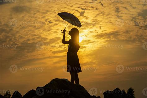 Silhouette sad girl at sunset. 13346052 Stock Photo at Vecteezy