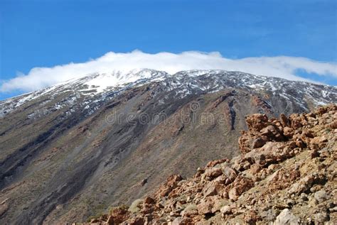 Mount Pico Viejo Summit with Snow and a Hat of Clouds. Stock Photo ...