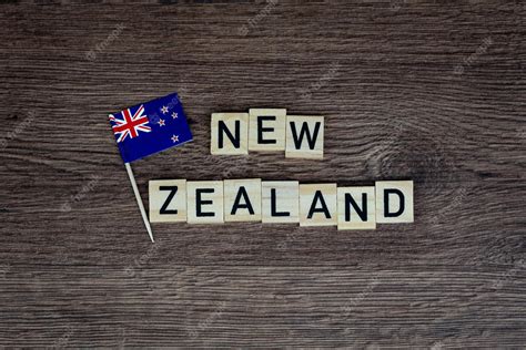 Premium Photo | New zealand - wooden word with new zealand flag (wooden ...