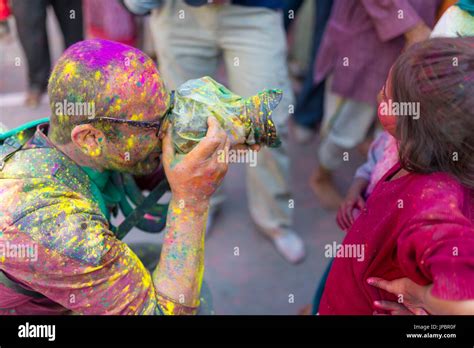 Photographer during the celebrations of the Holi festival in Mathura ...