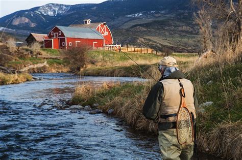 Fly-Fishing Photograph by Jonathan Irish An angler casts a line in a ...