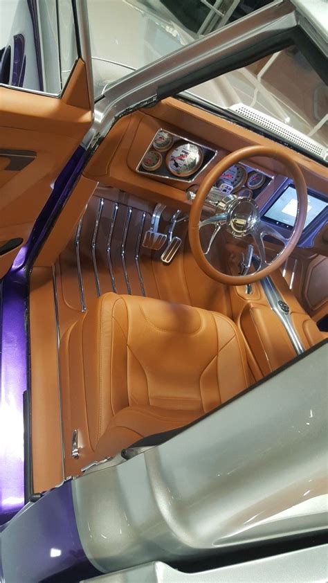 the interior of an old car with leather seats