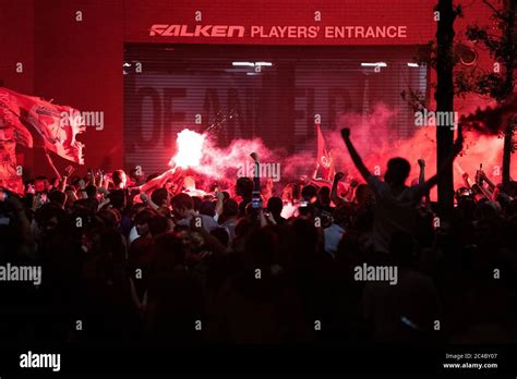 Liverpool fans celebrate outside Anfield, Liverpool Stock Photo - Alamy