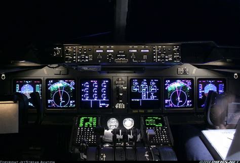 an airplane cockpit at night with illuminated instruments