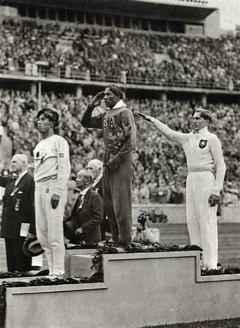 Jesse Owens on the podium after winning the long jump at the 1936 ...