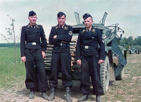 The crew of a Sd.Kfz 222 armored recon car pose for a photo together ...