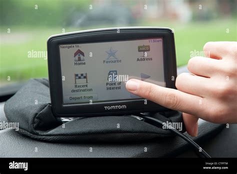 Setting up a Sat Nav device in a car Stock Photo - Alamy