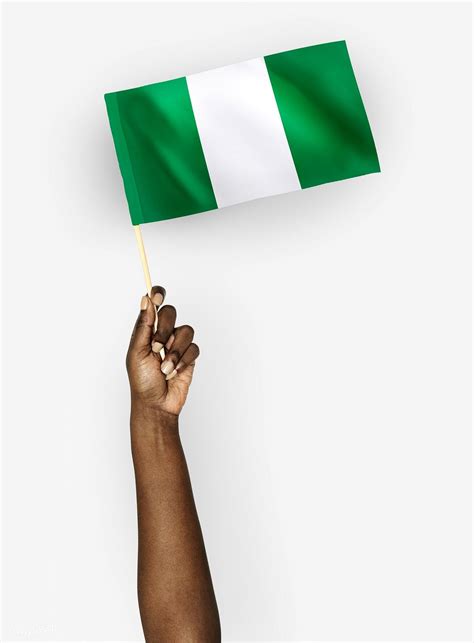 Person waving the flag of Federal Republic of Nigeria | free image by ...