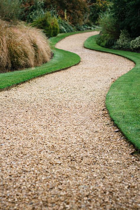 "A Gravel Path Snaking Through A Garden." by Stocksy Contributor "Helen ...