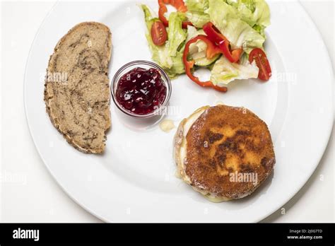 Breaded camembert with salad Stock Photo - Alamy