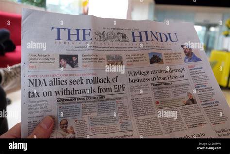 A man reads the Indian newspaper The Hindu in the hotel lobby in Delhi ...