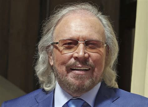 Knight fever: Bee Gees star becomes Sir Barry Gibb at palace