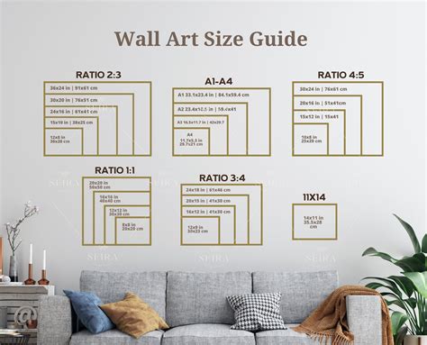 the wall art size guide is shown in gold on a white wall above a gray couch