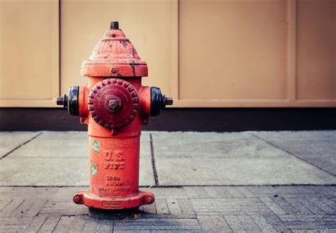 Premium Photo | Red Fire Hydrant on Gray Concrete Floor Photo