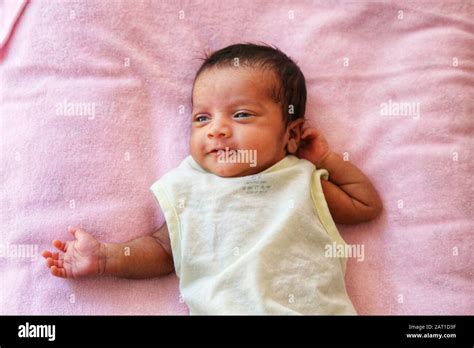 New born Indian baby girl smiling Stock Photo - Alamy