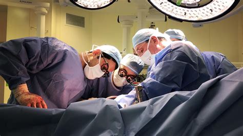 doctors performing surgery in an operating room