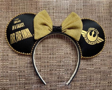 a mickey mouse ears headband with a star wars logo on it