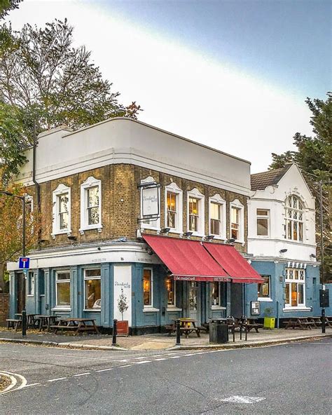 A pretty blue and red pub on a corner in Camberwell, London. This part ...