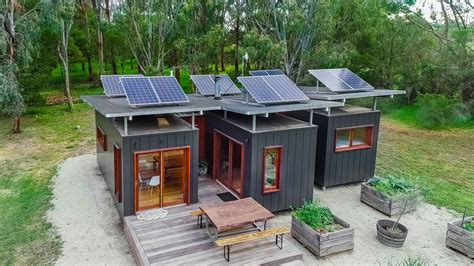 a small house with solar panels on the roof