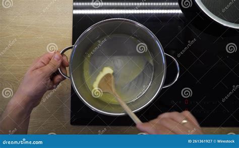 Top-view Footage of a Person Melting a Slice of Butter in the Saucepan ...