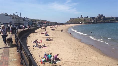 Peel, Isle of Man, UK. Busy afternoon. Beach, looking toward Peel ...