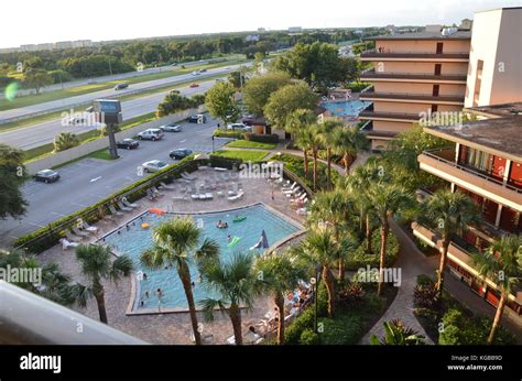 View of swimming pool at Rosen Inn at Point Orlando Stock Photo - Alamy