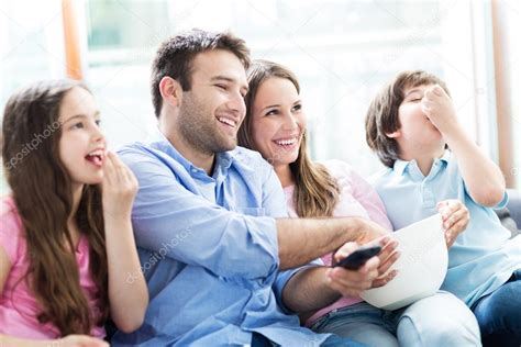 Family watching tv together — Stock Photo © pikselstock #74926469