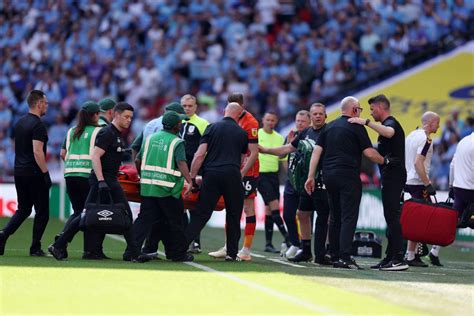 Tom Lockyer: Luton captain conscious and taken to hospital after ...