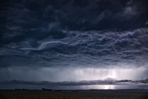 Panoramic landscape photography of nimbus clouds over island beside ...