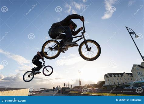 BMX stunts at the street stock image. Image of riding - 35259151