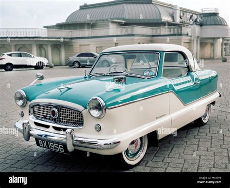 1956 Austin Metropolitan driving on coastal road Stock Photo - Alamy