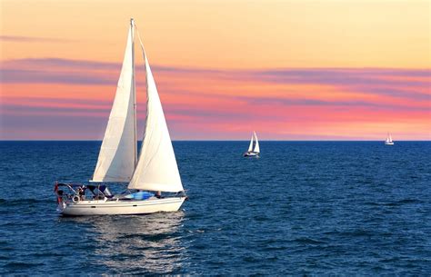 Sailboats on the water during sunset - Hope and Glory Inn