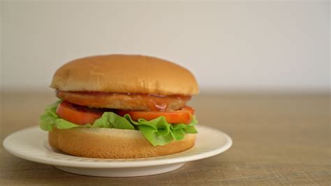 Chicken burger with sauce on plate 3107897 Stock Video at Vecteezy