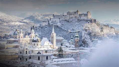 Snowy old city and fortress of Salzburg at winter sunny day, Austria ...