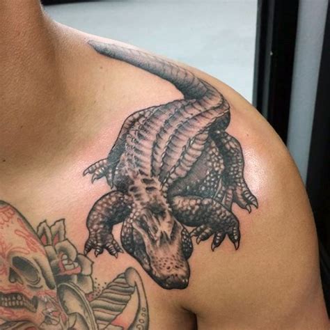 Little black and white realistic looking alligator tattoo on shoulder ...