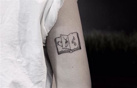 Small open book tattoo - Tattoogrid.net