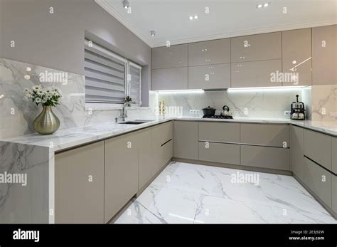 Luxury white modern marble kitchen in studio space Stock Photo - Alamy