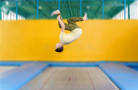 Teenage Boy Jumping on Trampoline Park in Sport Center Stock Image ...