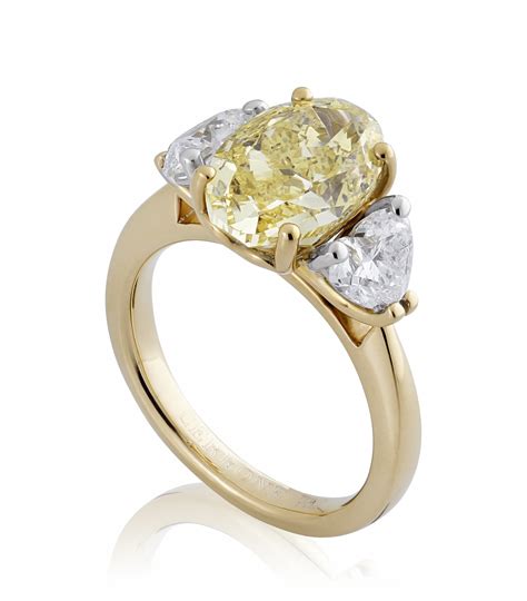 18ct yellow & white gold oval & heart three stone diamond ring | Cerrone