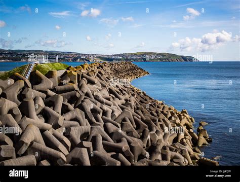 Concrete blocks forming a wave breaker at Douglas harbour Stock Photo ...