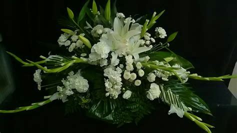 Casket spray... All white lilies, glads, buttons, carnations, and stock ...